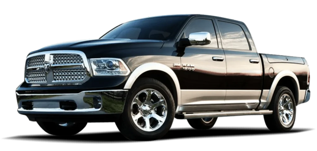 A black and silver Dodge Ram 1500 pickup truck with four doors and chrome accents, viewed from the front left side.